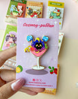 Cosmog-politan Pin